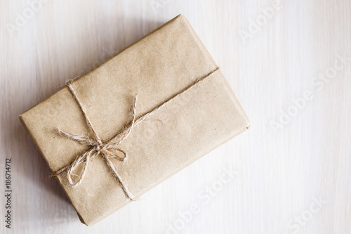 Vintage Brown gift box on wooden background - filter processing