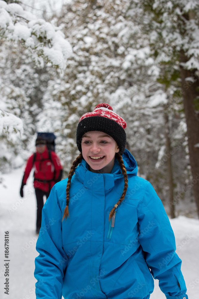 Family snowshoes in snow in Canada Family snowshoes in snow in Canada