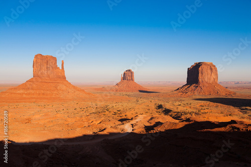 The famous Buttes of Monument Valley, Utah, USA during sunset on a clear autumn afternoon