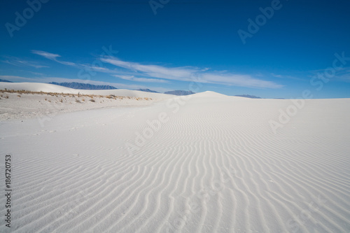 White Sands desert national monument sand dune shaps at Tularosa Basin New Mexico, USA photo