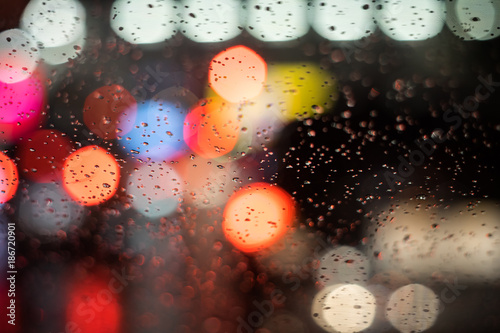 Abstract blur of light in the night with rain background