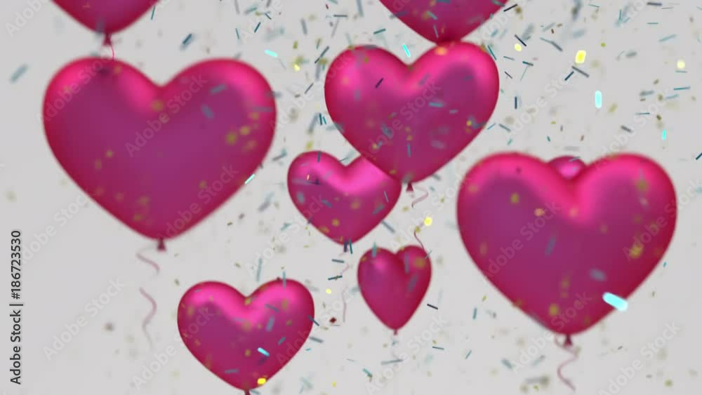 Flying heart balloons surrounded by falling shiny confetti Flying heart balloons surrounded by falling shiny confetti