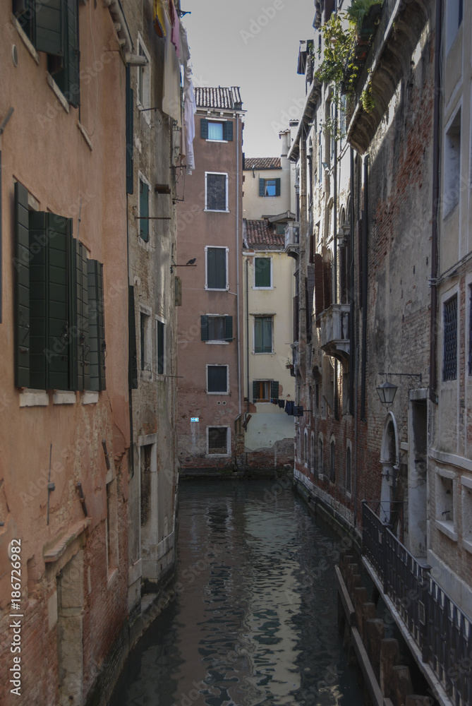 VENICE - ITALY, APRIL 18, 2009: Typical picturesque romantic Venetian canal - Venice, Italy