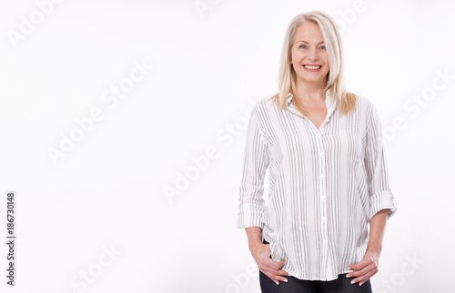 Friendly smiling middle-aged woman isolated on white background