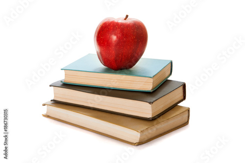 Red apple on books. White background