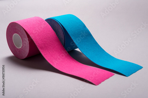Fotografie Kinesiology tape on colored background