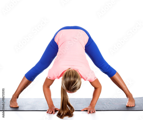 Woman doing yoga exercise, isolated on white background