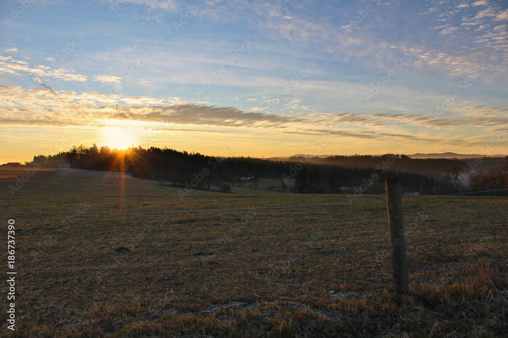 Amazing winter sunrise on Czech countryside with sunrays Amazing winter sunrise on Czech countryside with sunrays