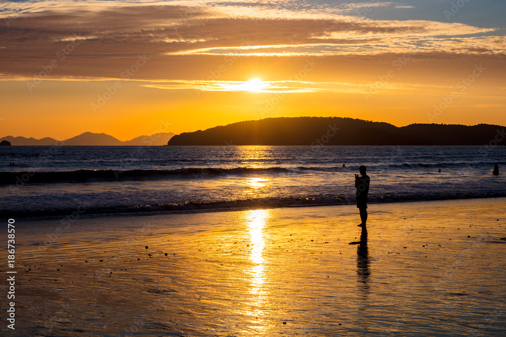 Fototapeta premium Silhouette Woman At Beach During Sunset