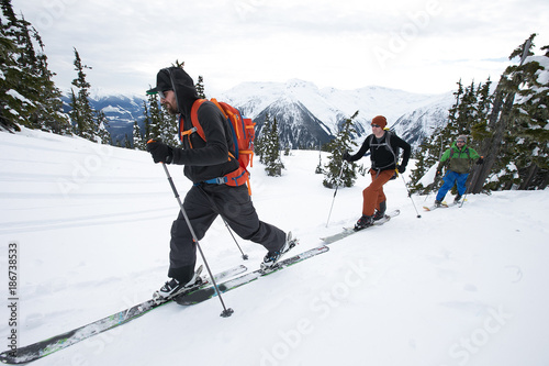 Obraz na płótnie Young men ski touring in the mountains w salonie