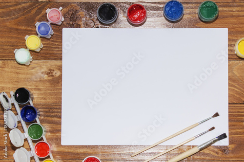 gouache, tassels, watercolor paint, white sheet of paper.