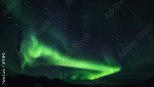 Wide timelapse, scenic aurora borealis above Norway landscape