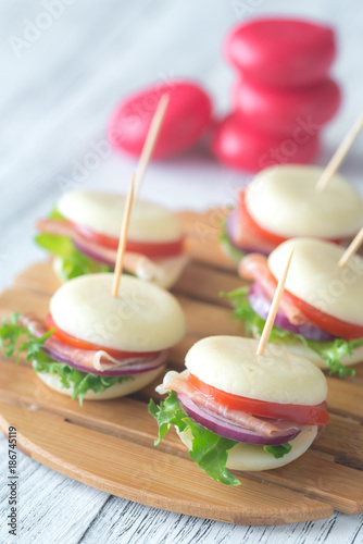 Mini cheese and prosciutto sandwiches photo