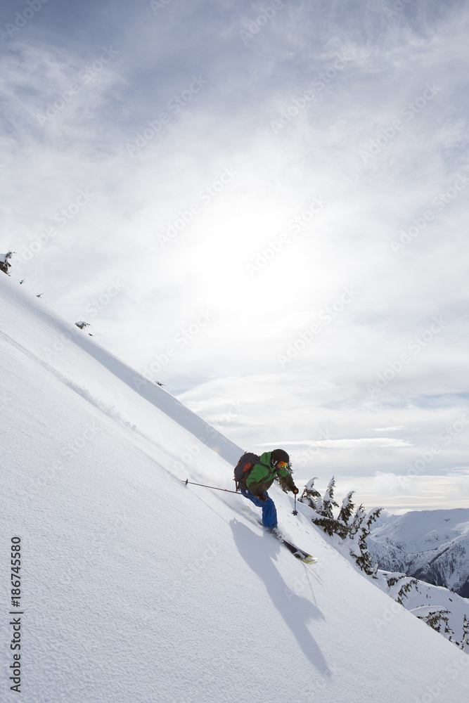 Young man skiing in the mountains