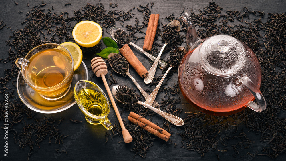 Black and green tea with lemon, honey, cinnamon and ginger. Hot drink Top view. Copy space. Black and green tea with lemon, honey, cinnamon and ginger. Hot drink Top view. Copy space.