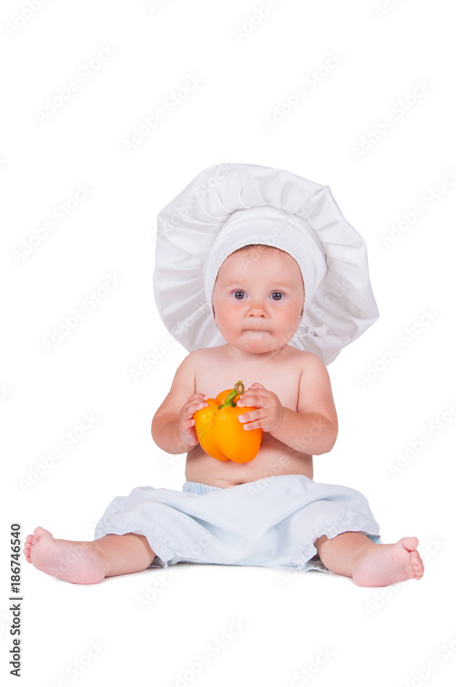 funny little girl in the clothes of a cook with pepper in her hands. funny little girl in the clothes of a cook with pepper in her hands.