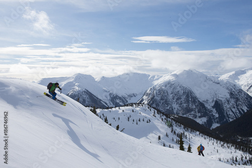 Young man skiing in the mountains © Colin