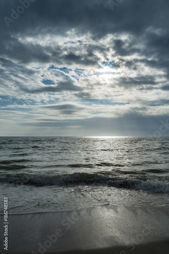 USA  Florida  Dramatic sky and cloud formations at a beach near tampa with reflections on water