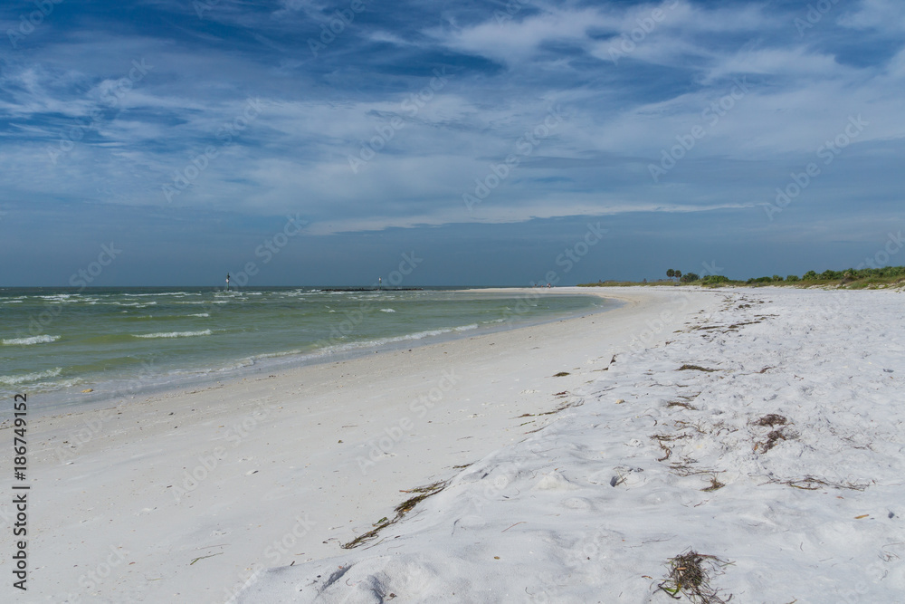 USA, Florida, Beautiful white sand beach of honeymoon island with painted sky