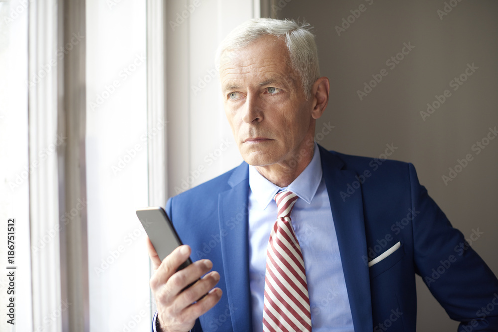 Elderly business man with mobile phone Elderly business man with mobile phone