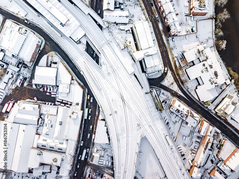 Aerial view of snow covered rail and road networks. Snow, ice and ...