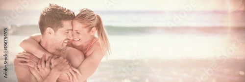 Happy lovers at the beach photo