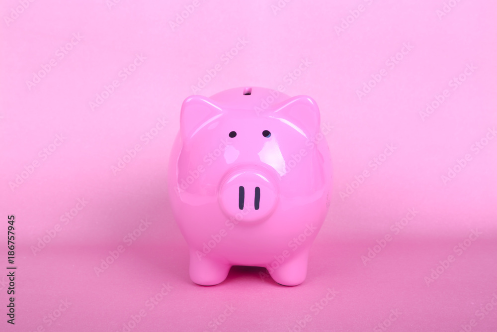 Piggy Bank on Soft Pink Background