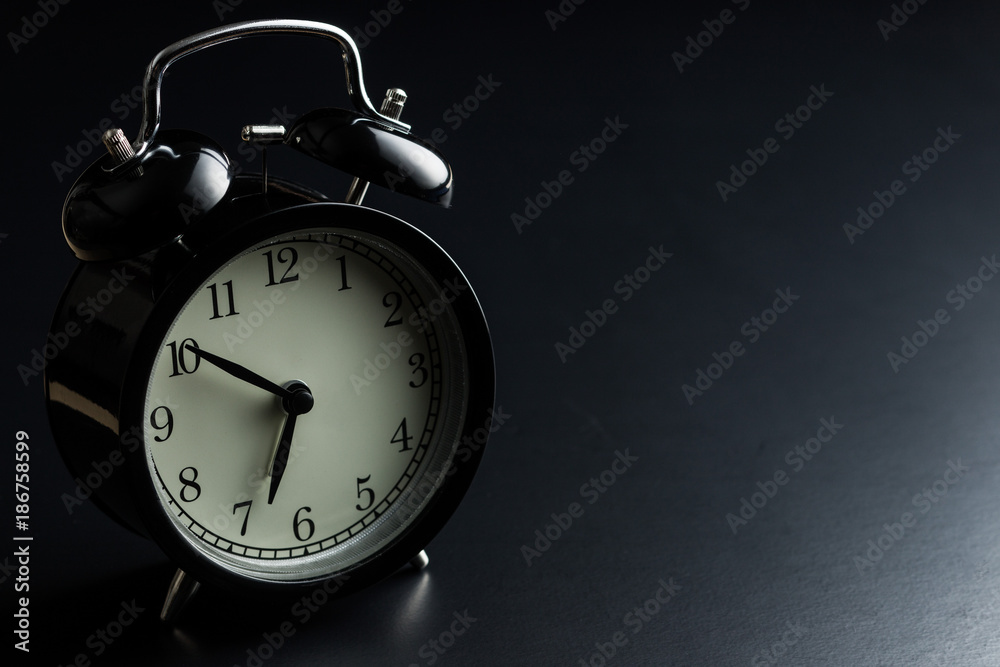 Black alarm clock. Black alarm clock.