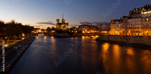 Notre dame de Paris by night and the seine river in the city of Paris in france © JEROME LABOUYRIE