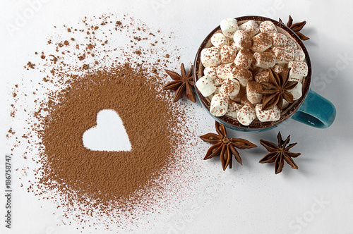 Valentine day backround marshmellow, blue cup coffee cocoa powder star anis.