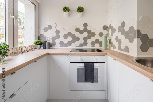 White kitchen with hexagonal tiles