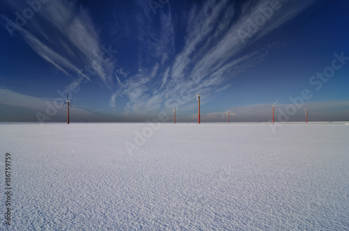Winter windmolens op een vroege ochtend in Flevoland, Windpark Jaap Rodenburg nabij Almere photo