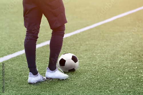 Goalkeeper football team with a soccer ball. © SKfoto