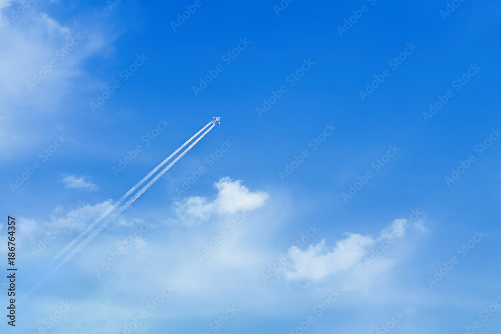 White clouds against a blue sky, flying aircraft White clouds against a blue sky, flying aircraft
