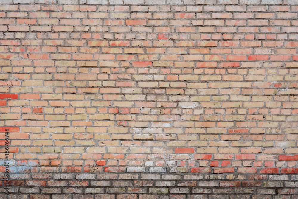 Fototapeta premium Brick texture with scratches and cracks