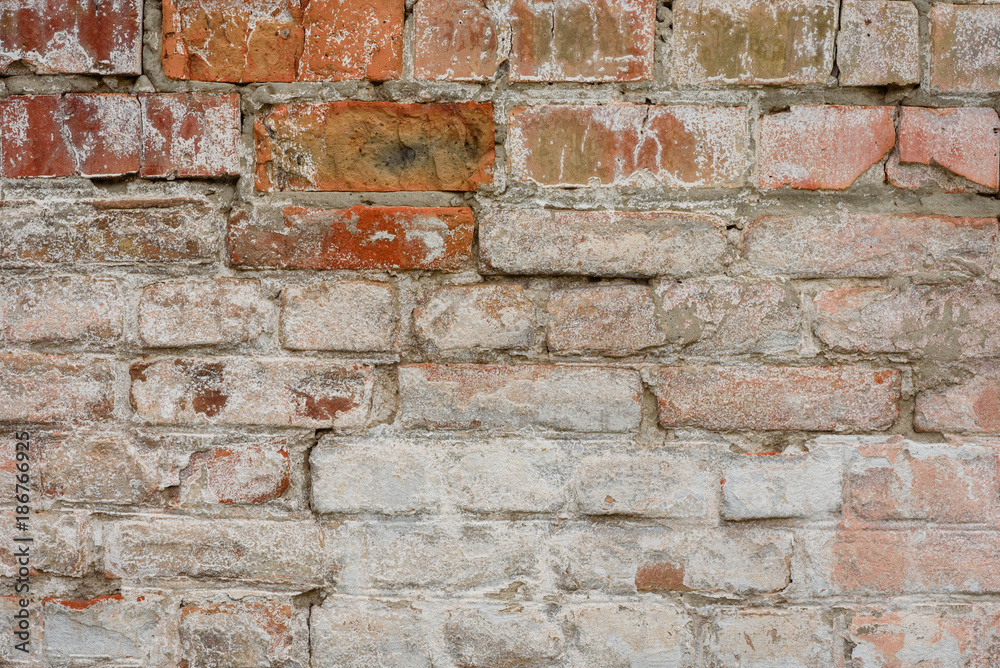 Fototapeta premium Brick texture with scratches and cracks