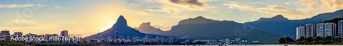 Panoramic image of the sunset seen from the lagoon Rodrigo de Freitas with the buildings of the city of Rio de Janeiro, hill Dois Irmãos and Gavea stone photo