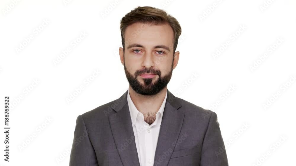 Close up portrait of determined man 30s in suit shaking head meaning rejection expressing denial saying NO or don't want over white background. Concept of emotions Close up portrait of determined man 30s in suit shaking head meaning rejection expressing denial saying NO or don't want over white background. Concept of emotions