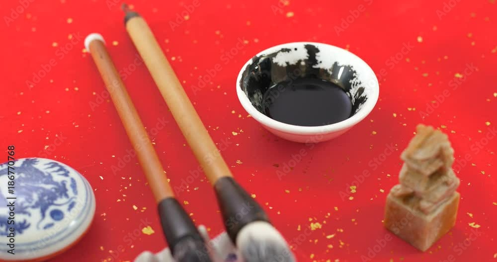 Brush dipping in ink Brush dipping in ink