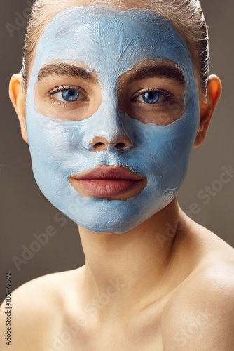 Spa Woman applying facial mask