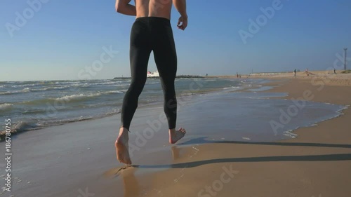 Sporty runner enjoying run on the sea. Healthly lifestyle concept