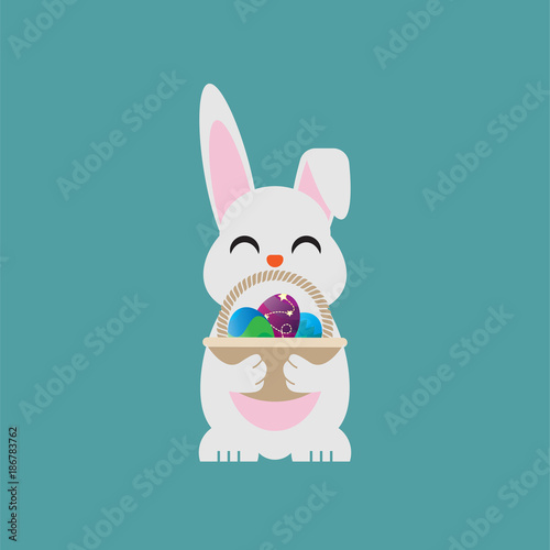Easter egg bunny holding a basket containing eggs © haris