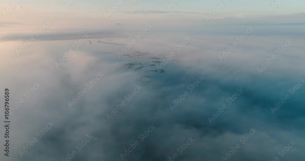 Aerial View. Flying over the clouds . Aerial camera shot. During the sunset. Landscape panorama. Aerial View. Flying over the clouds . Aerial camera shot. During the sunset. Landscape panorama.