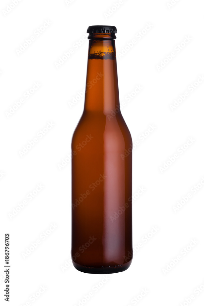 Brown glass beer bottle with black cap isolated