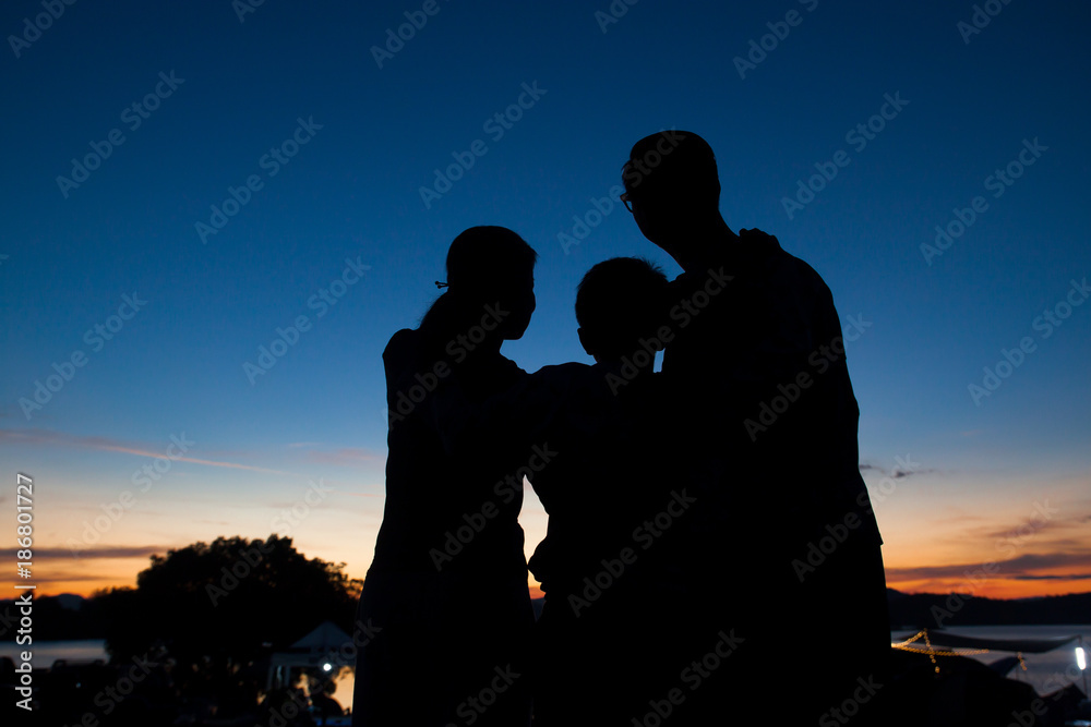 Silhouette family with twilight sky after sunset, Happy, Love, Healthy lifestyle concept