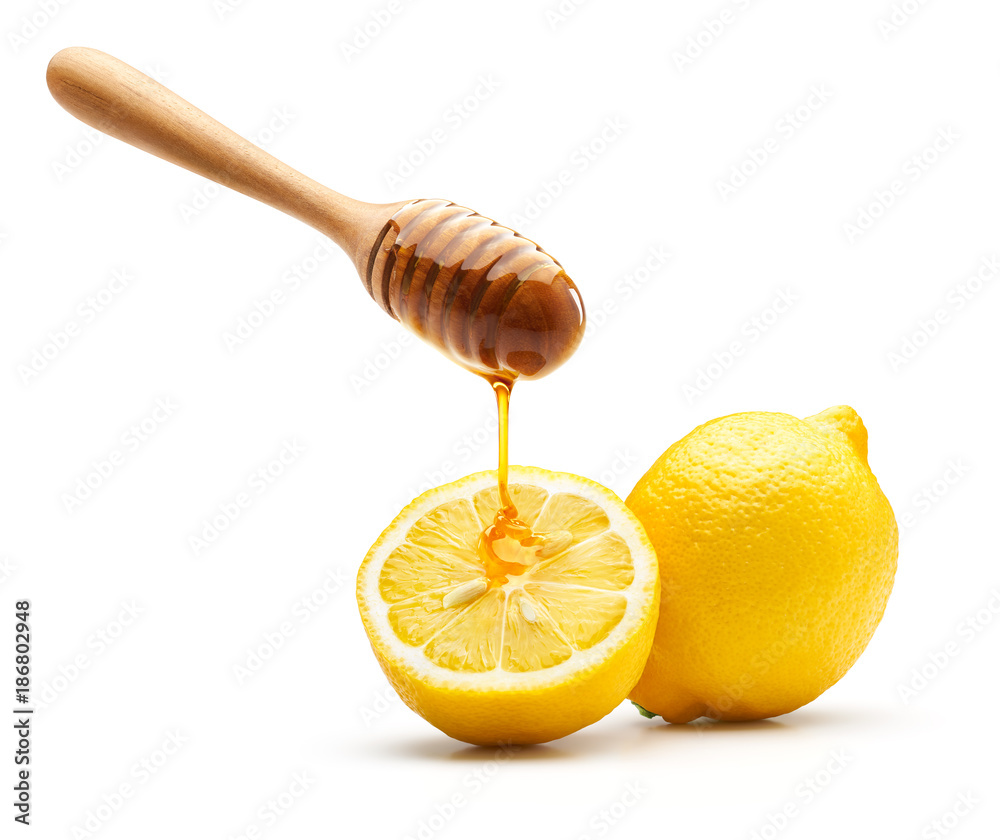Honey dripping on fresh lemon Honey dripping on fresh lemon