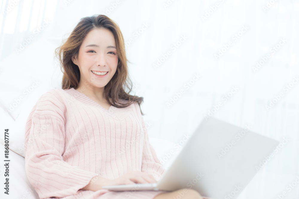 Attractive female using laptop at bedroom. People lifestyle concept. Attractive female using laptop at bedroom. People lifestyle concept.
