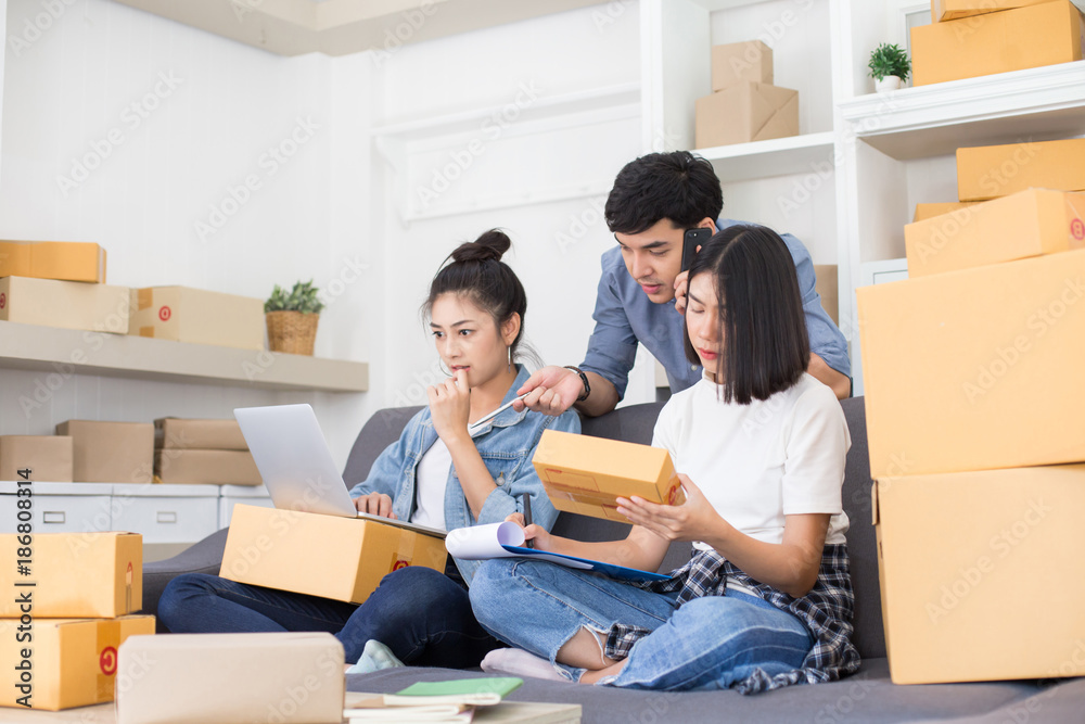 Asian people startup to small business together at home. Young Owner people startup for Business Online, SME, Delivery Project. Online Business Concept. Asian people startup to small business together at home. Young Owner people startup for Business Online, SME, Delivery Project. Online Business Concept.
