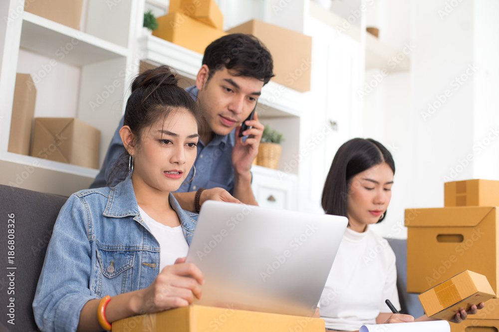 Group of Asian people working together for SME project. Young Owner people startup for Business Online, SME, Delivery Project. Online Business Concept. Group of Asian people working together for SME project. Young Owner people startup for Business Online, SME, Delivery Project. Online Business Concept.