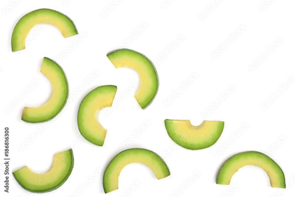 slices of avocado isolated on white background with copy space for your text. Top view. Flat lay slices of avocado isolated on white background with copy space for your text. Top view. Flat lay
